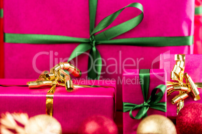 Four Xmas Presents Wrapped in Plain Magenta