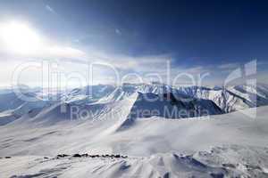 Off-piste slope and sky with sun