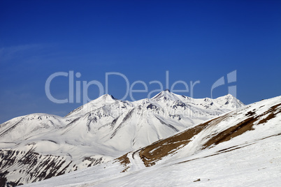 Ski slope and snowy mountains