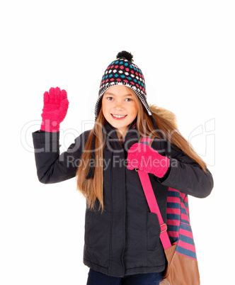 Young girl waiving good by.