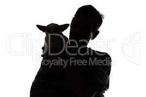 Silhouette of adult man with the dog