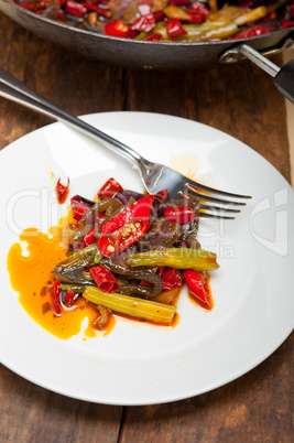 fried chili pepper and vegetable on a wok pan