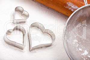 Cookie cutters and flour sieve