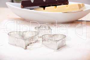 Cookie cutters and white and dark couverture