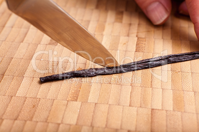Cutting open the vanilla pod with a knife