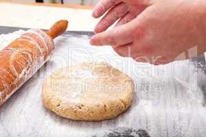 Roll out the biscuit dough on the baking mat