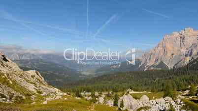 time lapse clouds contrails over dolomites valley pan 11552