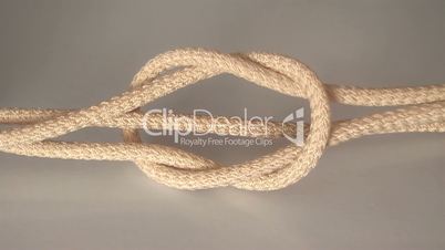 tied the rope and pulled the knot