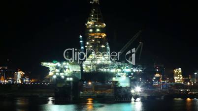 oil platform in port at night