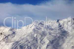 View on off-piste slope in wind morning