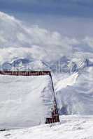 Roof of hotel in snow and ski slope