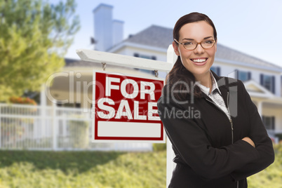 Young Woman in Front of House and Sale Sign