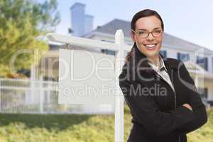 Woman In Front of House and Blank Real Estate Sign