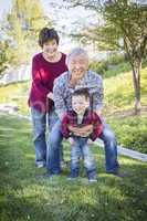 Chinese Grandparents Having Fun with Their Mixed Race Grandson O