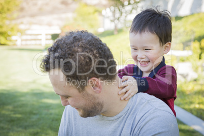 Caucasian Father Having Fun with His Mixed Race Baby Son