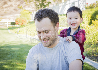 Caucasian Father Having Fun with His Mixed Race Baby Son