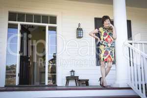 Attractive Chinese Woman On Her Front Porch
