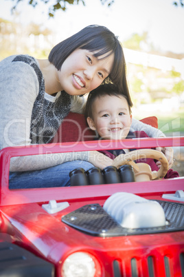 Chinese Mother Having Fun with Her Mixed Race Baby Son