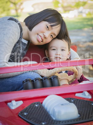 Chinese Mother Having Fun with Her Mixed Race Baby Son