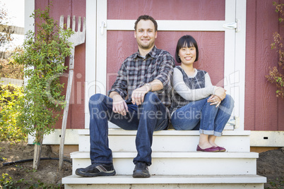 Mixed Race Couple Relaxing on the Steps