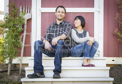 Mixed Race Couple Relaxing on the Steps