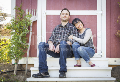 Mixed Race Couple Relaxing on the Steps