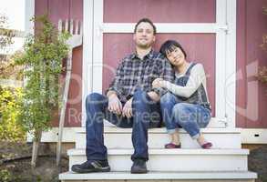 Mixed Race Couple Relaxing on the Steps