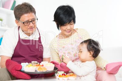 Asian family baking cake