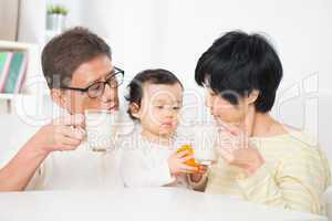 Asian family drinking milk