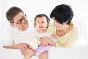 Asian family with crying baby