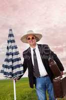 Man with suitcase and umbrella