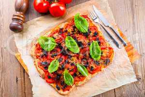 homemade olive - tomato pizza