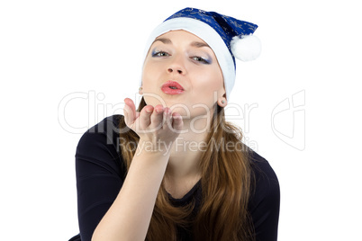 Photo of kissing young woman in christmas hat
