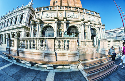 VENICE - APRIL 7, 2014: Tourists enjoy Saint Mark Square on a be