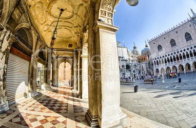 VENICE - APRIL 7, 2014: Tourists enjoy Saint Mark Square on a be