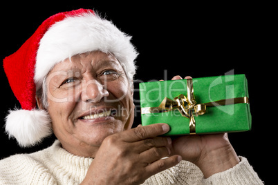 Elderly Man with Santa Cap And Green Wrapped Gift