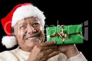 Elderly Man with Santa Cap And Green Wrapped Gift