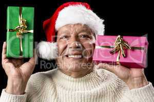 Kind Aged Gentleman With Red Cap Raising Two Gifts