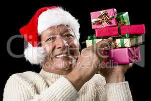 Male Senior Firmly Pointing At Six Wrapped Gifts