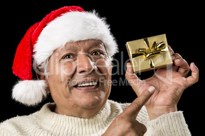 Aged Man With Emphatic Look And Golden Gift
