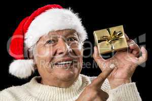 Aged Man With Emphatic Look And Golden Gift