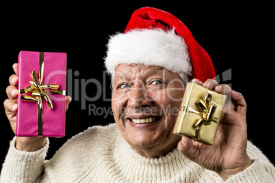 Happy Male Senior Showing Two Wrapped Presents