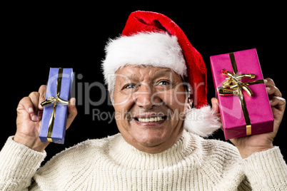 Euphoric Old Man With Two Presents And Santa Hat