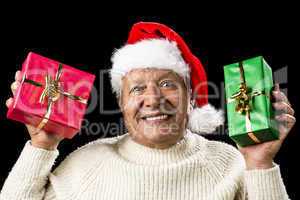 Poignant Aged Man Showing Red And Green Xmas Gifts