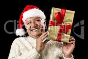 Smiling Old Man With Golden Gift Isolated On Black