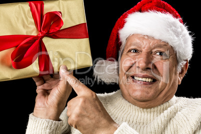 Excited Aged Man Pointing At Golden Gift In Hand
