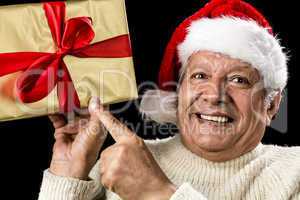 Excited Aged Man Pointing At Golden Gift In Hand