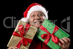 Old Man In Red Gaping Across Two Wrapped Gifts