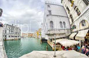 VENICE - APRIL 7, 2014: Tourists enjoy city canals on a beautifu