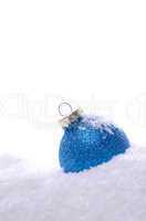 Blue Christmas bauble with snow